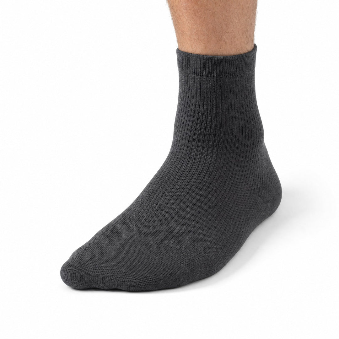 A foot in an ordinary sock, all five toes pressed together